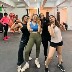 Training is hard work, but we make sure it's a great experience. Our members celebrate together after a tough but rewarding boxing workshop, highlighting the strong sense of community in our classes.