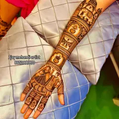 A single arm design featuring a story-telling mehndi with a bride and groom, kalash pots, and an elephant procession.