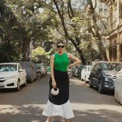 A street style shot in Colaba, Mumbai, with the model posing in the middle of the road, capturing the city's vibrant energy.