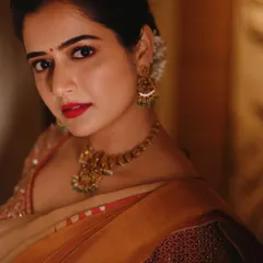 "ಮುಚ್ಚಿರುವ ಕಣ್ಣಿನಲ್ಲೂ ಮೂಡಿರುವ ಬಣ್ಣ ನೀನು!" You are the color that appears even in closed eyes. This close-up portrait is an example of how I use warm, soft lighting to create an intimate and serene mood, focusing entirely on the subject's expression and the delicate details of her makeup and jewelry.