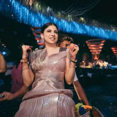 Shikha making a fun entrance at her cocktail event in Raipur. Her makeup is chic and modern, with a sleek ponytail and defined eyes that perfectly suit her metallic Amit Aggarwal gown.