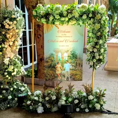 I believe in making the welcome personal. This custom welcome sign, featuring the couple's photo, was framed by a beautiful floral arch, telling their story from the moment guests arrived.