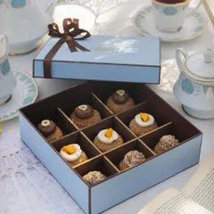 This assorted choux pastry box makes for a light and elegant gift. It includes a variety of flavors like Chocolate Hazelnut, Mango & Cream Cheese, and Classic Vanilla, all nestled in a beautiful gift box.