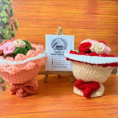 This view shows the reversible dolls flipped to their bouquet form. The intricate crochet work turns the doll's skirt into a lovely bucket holding a bunch of handmade roses.