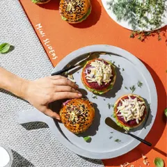 My mini sliders are always a crowd-pleaser. I use freshly baked, seeded buns and fill them with crisp vegetables, a secret sauce, and our earthy, homemade vegetarian patties. They are designed to be an irresistible gourmet experience.