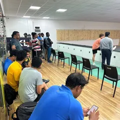 Participants at a corporate day out listen intently to instructions from our coaches. These sessions are a great way to de-stress and learn a new skill outside the office environment.