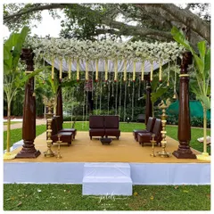 Set against a lush green backdrop at the Signature Club Resort, this traditional mandap exudes grace. I used majestic wooden pillars, a canopy of white chrysanthemums, and hanging temple bells to create a serene and sacred space.