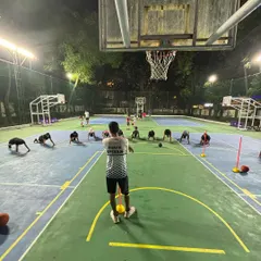 A full-court view of a conditioning session. Our players are working on core strength and endurance to ensure they can perform at their best for the entire game.
