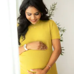 The gentle connection between a mother and her unborn baby. This close-up shot in the studio captures the soft details and the quiet love that fills these moments.