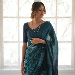This is our hero item. The Nilā saree embodies our craft. It is a deep indigo silk georgette piece that took over 60 hours to create, combining intricate textures and custom-carved floral motifs using a specialized discharge printing technique.