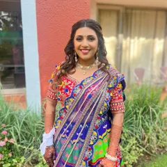 Carnival vibes for this gorgeous bride. We created a fun, vibrant look with playful colors, glowing skin, and a bold lip to match the festive atmosphere of her mehendi carnival.