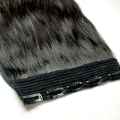 Another view of the seamless construction of our 5-clip weft. The clips are stitched securely to a fabric base that lies flat against the head for a comfortable and discreet fit.