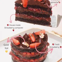 An inside look at our Belgian Dark Chocolate Strawberry Bento Cake. It's made with layers of rich chocolate ganache, house-made strawberry compote, and topped with fresh strawberries and gold foil.