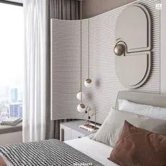 A close-up on the bedside details, showing the unique curved and fluted wall panel, geometric wall art, and delicate pendant lighting that add layers of sophistication.