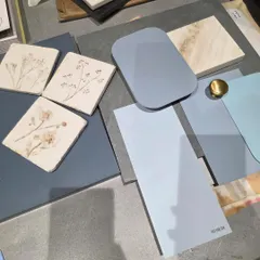 This mood board captures a softer, more serene palette. The gentle blues, hand-painted floral tiles, and light wood samples come together to evoke a sense of calm and quiet elegance for an upcoming kitchen design.