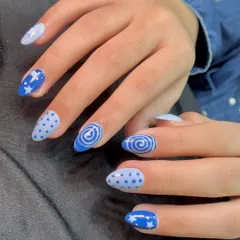 For a fun and playful look, I created this mix-and-match blue set. It features hand-painted stars, polka dots, and swirls, showing how different patterns can come together for a cohesive and creative style.