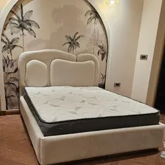 This is one of my most popular "dreamy" bed designs. The unique, cloud-like shape of the upholstered headboard creates a soft, sculptural centerpiece for the room.