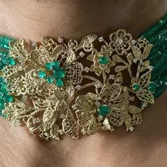 A stunning view of my emerald and gold lace choker, worn by Janhvi Kapoor. This piece combines the intricacy of hand-woven gold with the vibrant green of Zambian emeralds and the sparkle of diamonds.