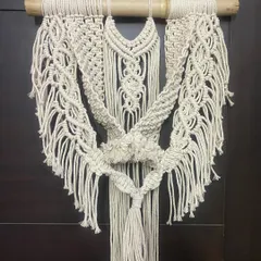 This intricate wall hanging features multiple knotting patterns, including the "DNA wala design" my daughter named. It's a substantial piece, perfect for making a statement on a main wall.