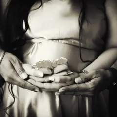 A timeless black and white version of our popular baby shoes announcement shot. This classic edit adds an extra layer of emotion and artistry to the image.