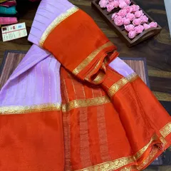 A beautiful wrinkle crepe Mysore silk saree in lavender and orange. These sarees are Silk Mark certified and have a unique texture that drapes beautifully.