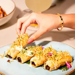 A savory twist on a classic pastry. Our Truffle Mushroom Éclair features an earthy mushroom filling, finished with a delicate parmesan frosting and crispy leeks. This bite-sized creation is a perfect example of how we reimagine familiar concepts for a luxury catering experience.