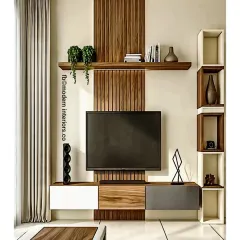 This TV unit design features a striking vertical wood panel that contrasts with the white and grey console. The asymmetrical layout includes a floating shelf and a unique block-style shelving unit on the side for displaying art and books.