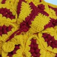 A beautiful crochet woolen dress in a festive combination of yellow and maroon. This design is part of my Diwali collection, made to keep Bal Gopal warm during the cooler festival nights.