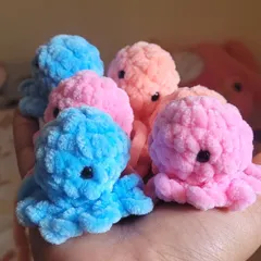 A handful of my fluffy octopus plushies, made with super soft velvet yarn. These little guys are perfect as small gifts or can be turned into adorable keychains to take with you anywhere.