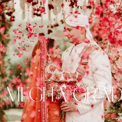 A romantic moment between Megha and Grady, captured through a shower of petals during their beautiful fusion wedding ceremony.