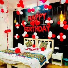 Another angle of this popular red and white birthday room decor. I ensure the balloons are placed thoughtfully to fill the space without it feeling cluttered.