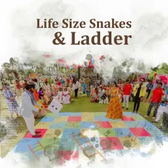A life-size Snakes & Ladders game set up on the lawn, providing a fun and nostalgic activity for guests of all ages.