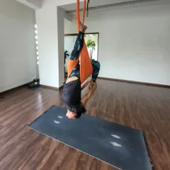 A student finds her wings during an aerial yoga session. The initial moments of trusting the hammock lead to an incredible feeling of freedom and accomplishment.