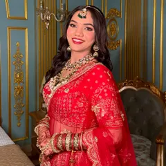 The beautiful Pragati, ready for her pheras. This classic red bridal look is all about radiant skin and bold lips, creating a timeless memory.