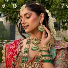 Bringing to life the timeless beauty of a South Indian bride. This portrait showcases the intricate details of her temple jewellery, the gajra in her hair, and the soft glam makeup that completes the look.