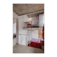 A view of the multi-level arrangement in the student housing units. This sectional design creates a complex and interesting interior landscape, providing students with both private nooks and shared spaces for interaction.