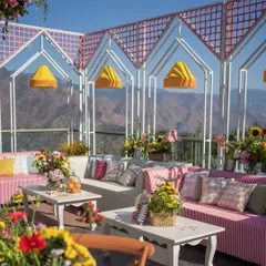 The stunning Himalayan foothills provide a dramatic backdrop for this vibrant and playful 'Picnic in the Mountains' mehendi in Mussoorie.