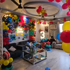 Another angle of the full-room Marvel decoration, highlighting the light-up number '3' and the different balloon arrangements used throughout the space.