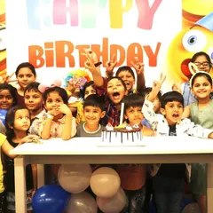 Look at those happy faces! A birthday party with us means non-stop fun with friends. This group is all smiles and ready to cut the cake after an exciting hour in the play area.