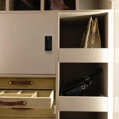 Inside the wardrobe, every detail is considered. We designed multipurpose drawers for accessories, dedicated cubbies for handbags, and a secure locker, ensuring there is a perfect place for every treasured item.