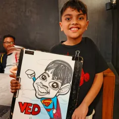 This young man is now a superhero. I love creating themed caricatures for kids' parties, turning them into their favorite characters.