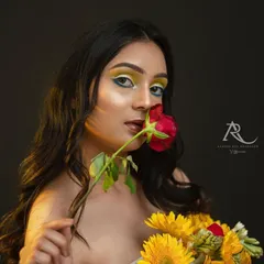 A simple prop like a single rose can completely change the story. This playful, engaging shot adds another dimension to the model's portfolio, showing she can deliver a variety of expressions from intense to charming.