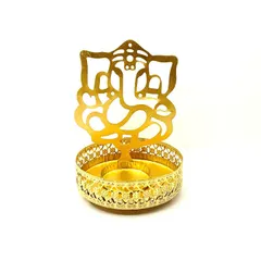 This golden Ganesha tealight holder is both a decorative and spiritual piece. When you place a lit tealight inside, it projects a serene shadow of Ganesha onto your wall.