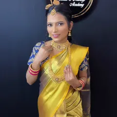 A beautiful South Indian bridal look, featuring a golden silk saree and traditional temple jewellery. Our students learn to create this classic and graceful style.