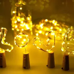 These small, battery-operated fairy lights are great for adding a warm glow to your setup. They can be placed in bottles or woven into the decorations for extra sparkle.
