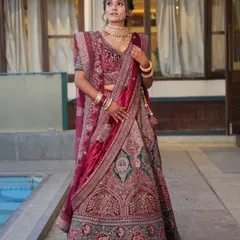 For a grand reception, a bride deserves to feel like royalty. I designed this full-glam look to match the opulence of her deep red velvet lehenga, ensuring she was the star of the evening.