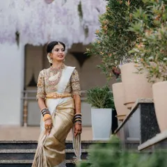 This bride looks absolutely regal in her off-white and gold silk saree. I created a soft, glowing makeup look with a clean updo to highlight her features and the intricate details of her bridal attire.