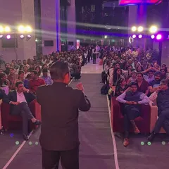 Performing for a huge audience at a corporate Diwali event is always an amazing experience. This shot shows me engaging with a crowd of hundreds, proving that my magic can fill even the biggest stages and bring everyone together for a shared moment of wonder.