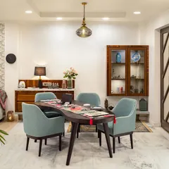 The bean-shaped dining table at our Ridge View project defies convention, adding a sense of spontaneity and movement. Designed to be a hub for interaction, it flows seamlessly into the rest of the home, creating an airy, connected environment for shared experiences.