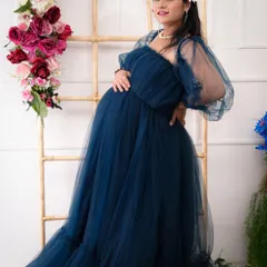 This shot showcases the beautiful silhouette of the mother-to-be. The soft lighting and her gentle pose highlight the beauty and strength of pregnancy.